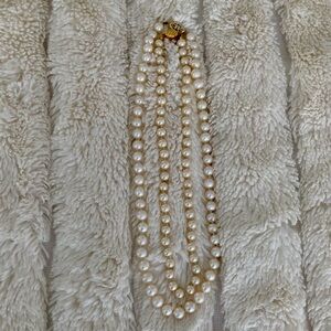 Two Strands of Faux Pearls. One White, one more champagne.